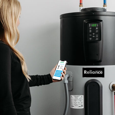person scanning a qr code on a water heater person scanning a qr code on a water heater
